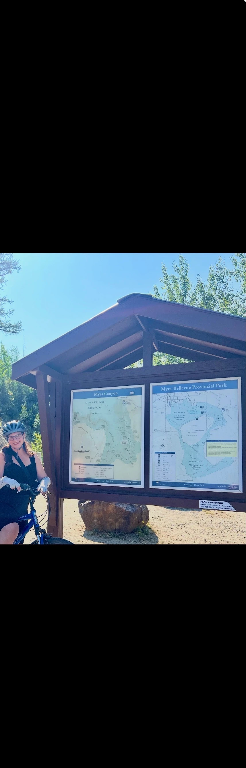 A cycling stop at the Myra Canyon trail information board