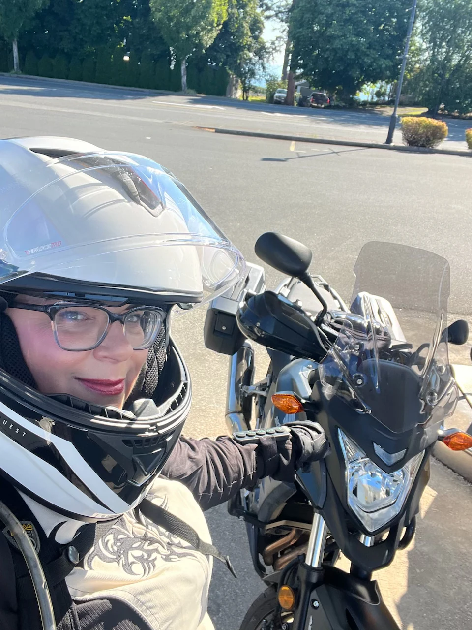 Helmet on, alongside my motorcycle